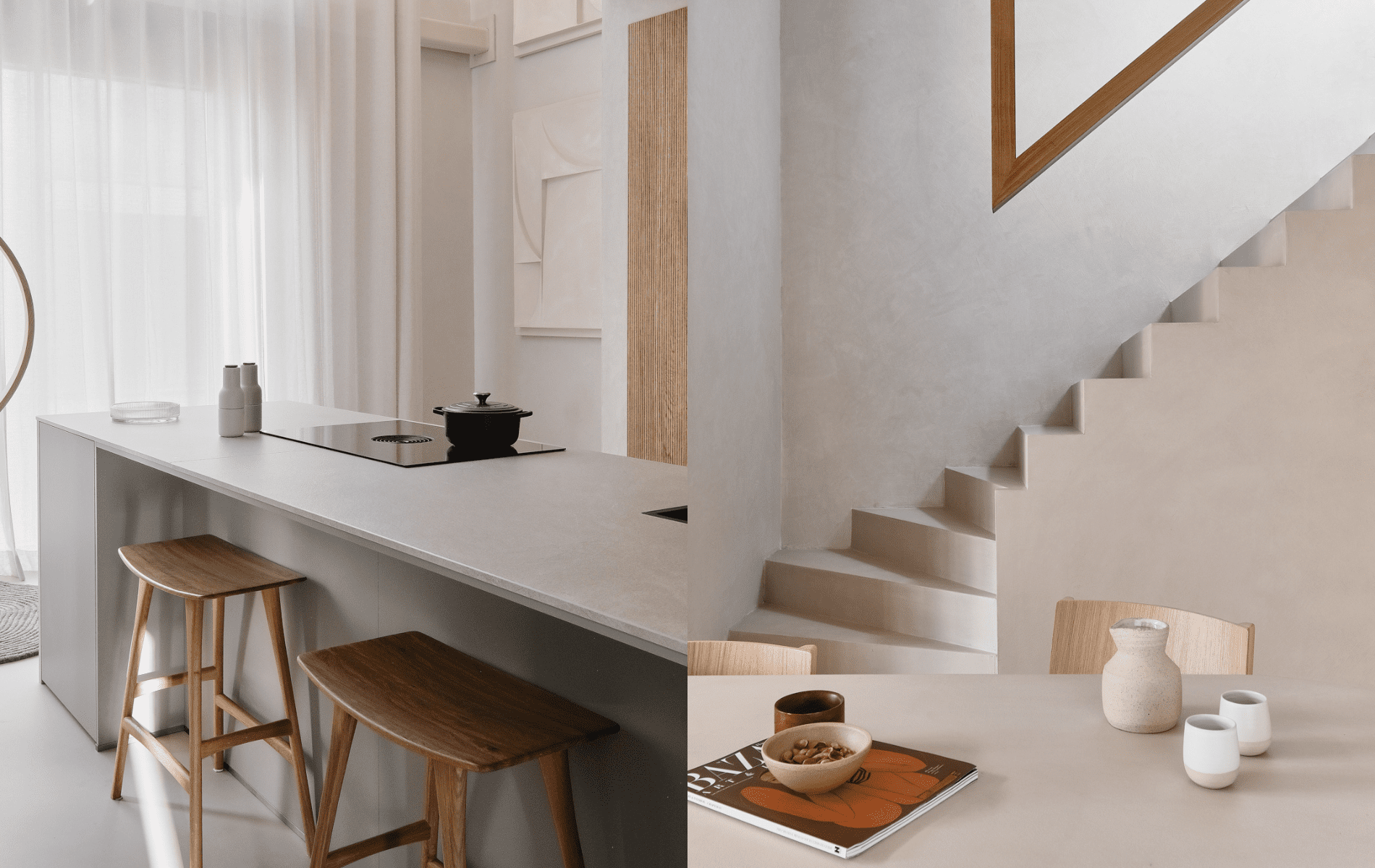 Stijlvolle combinatie van een strak keukeneiland en sculpturale trap in The Townhouse, met aandacht voor vorm, materiaal en serene eenvoud.